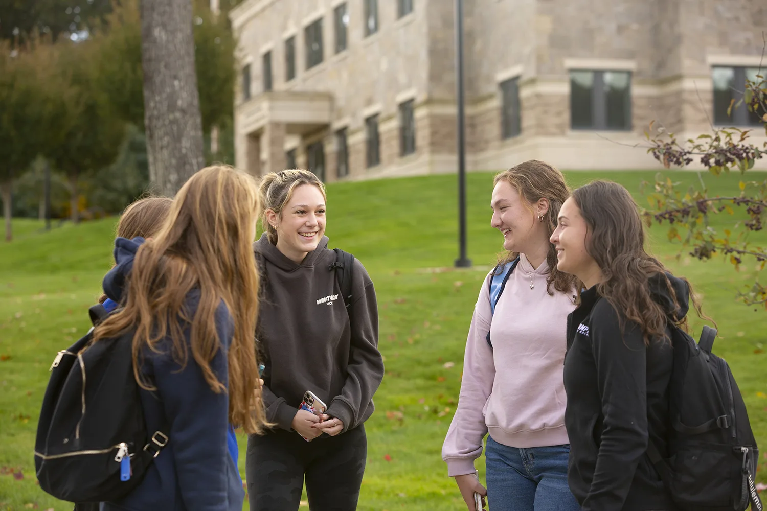 Group of students outside talking.