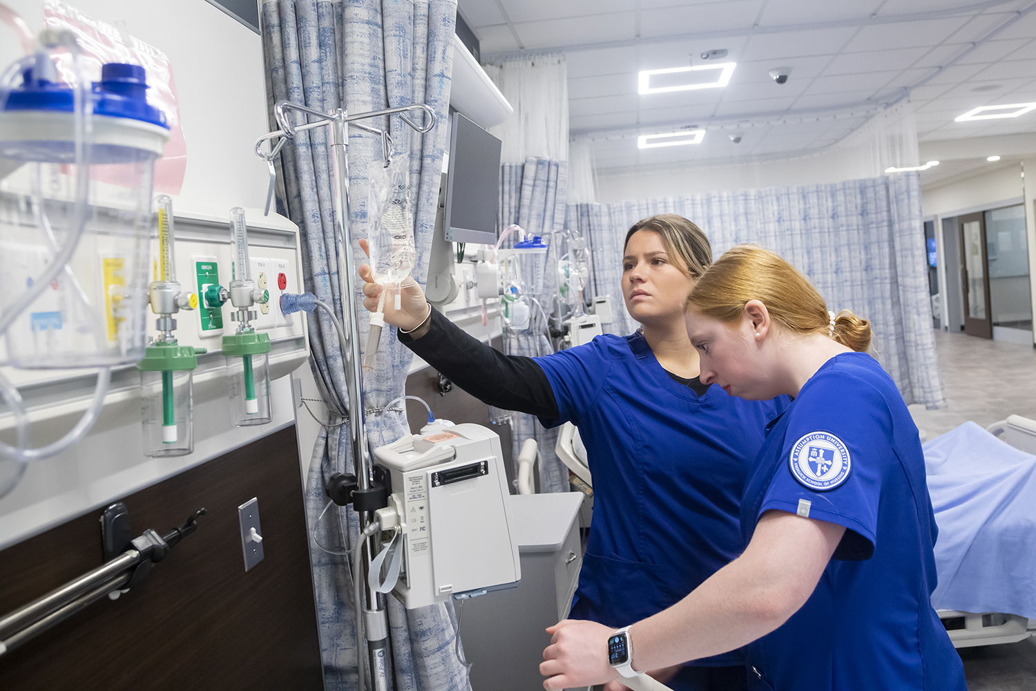 nursing students looking at IV medication