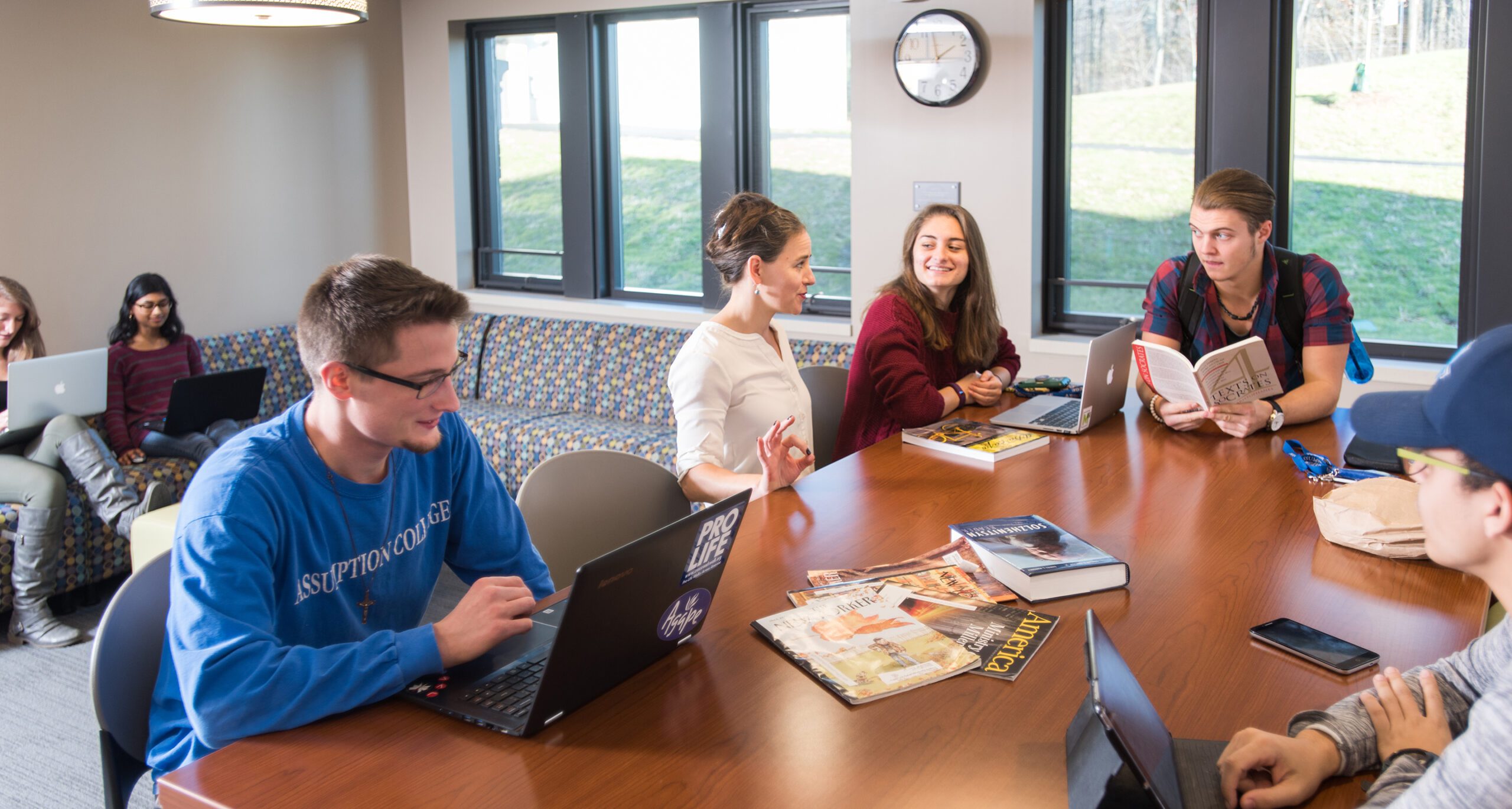 Assumption students in the new Honors Lounge in the Tsotsis Family Academic Building.