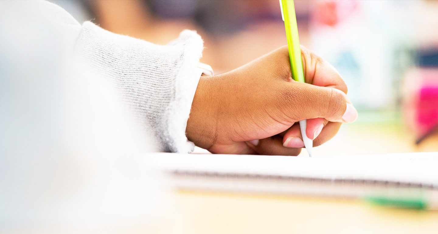 Student filling out forms in the finance office