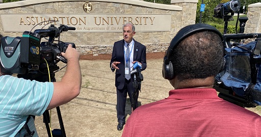 Assumption University President Francesco Cesareo being interviewed by media.