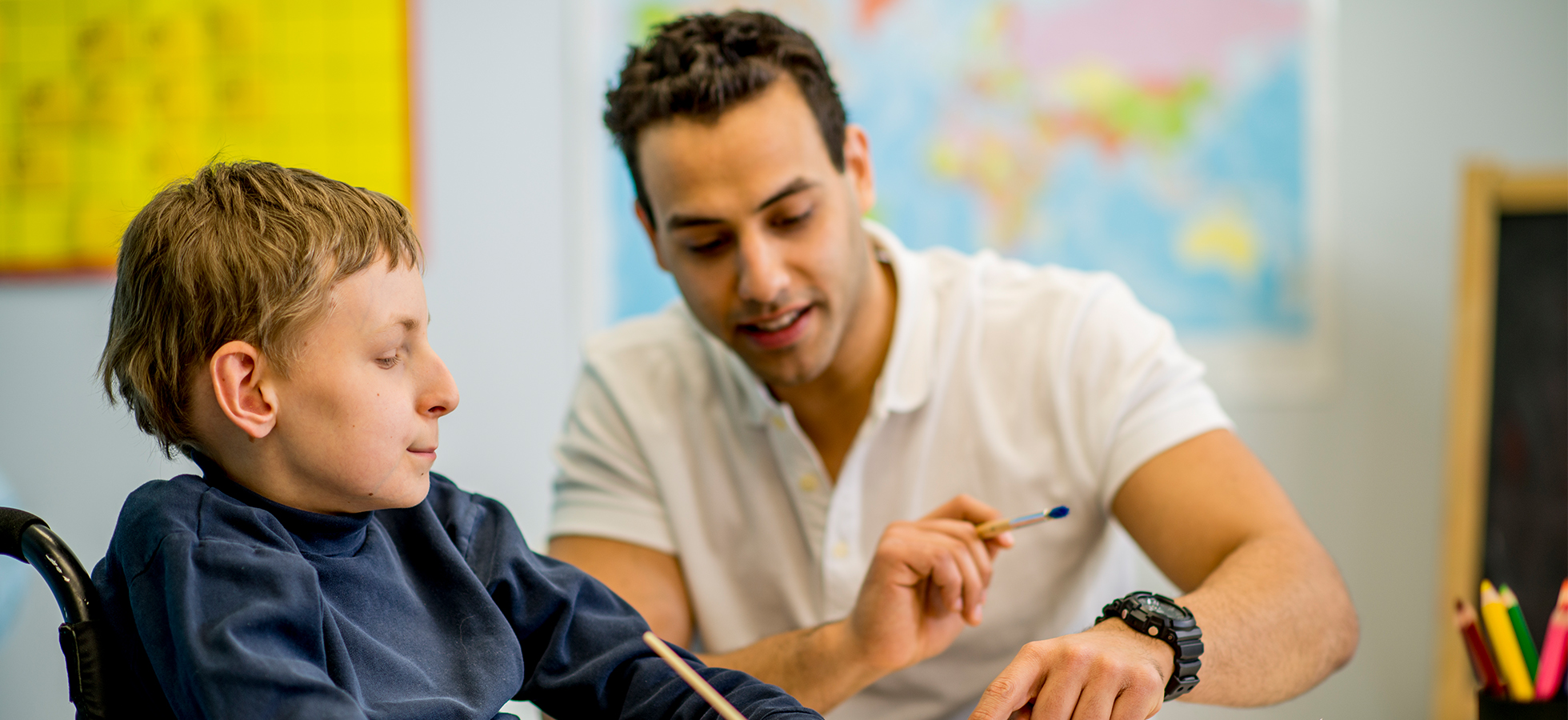 Teacher with a child in a classroom setting. The Assumption ABA program provides opportunities to work with faculty in the psychology, human services and rehabilitation studies, and education departments.