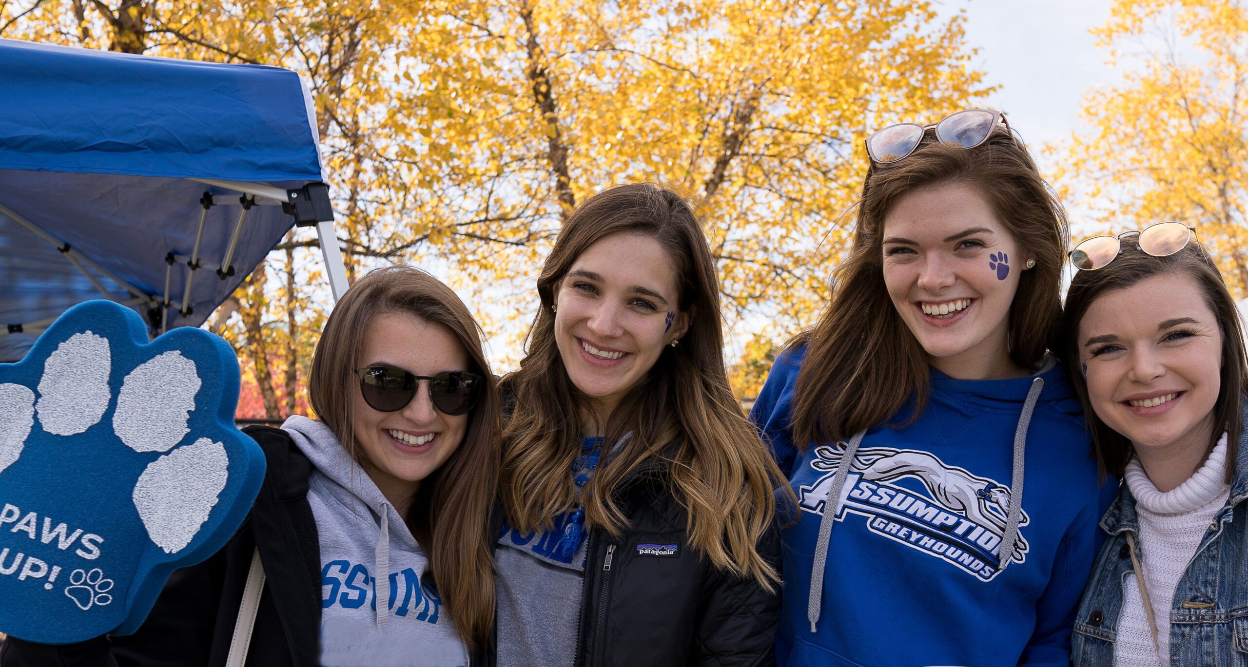 Female students with foam celebration paws