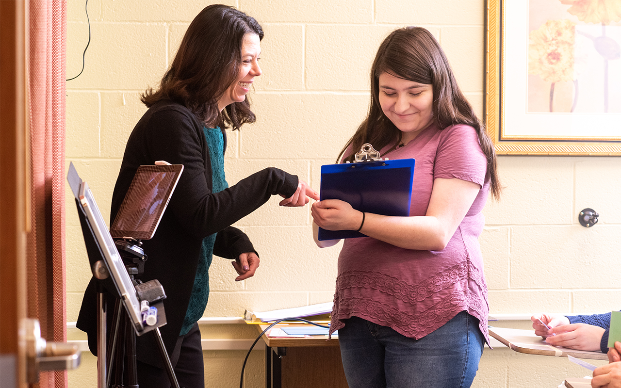 Professor Karen Lionello-Denolf and an Assumption University student discuss the innovative Graduate Fellowship for students at the The New England Center for Children (NECC).