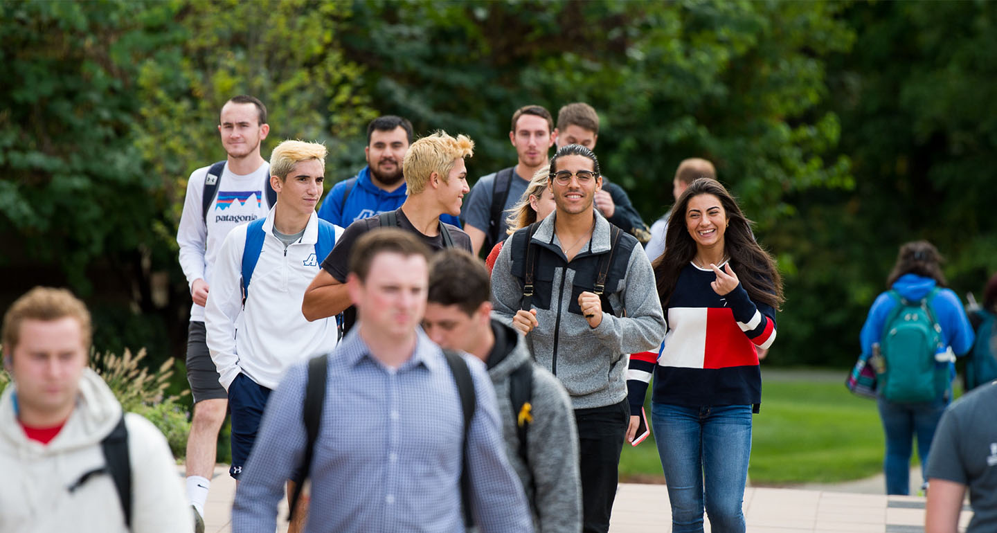 Assumption University walking in groups on the Worcester campus.