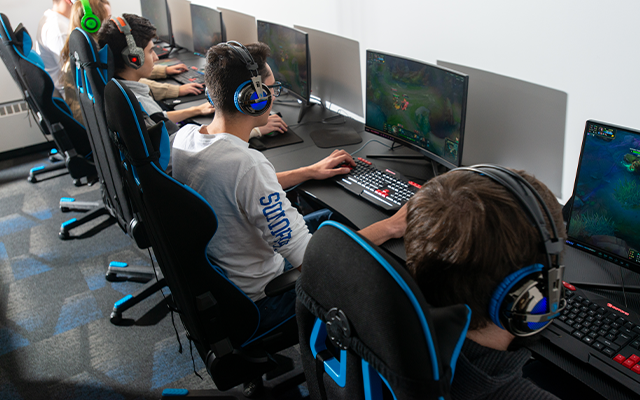 Students in front of computer gaming screens