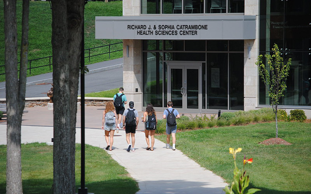 Students walking in front of Catrambone building.