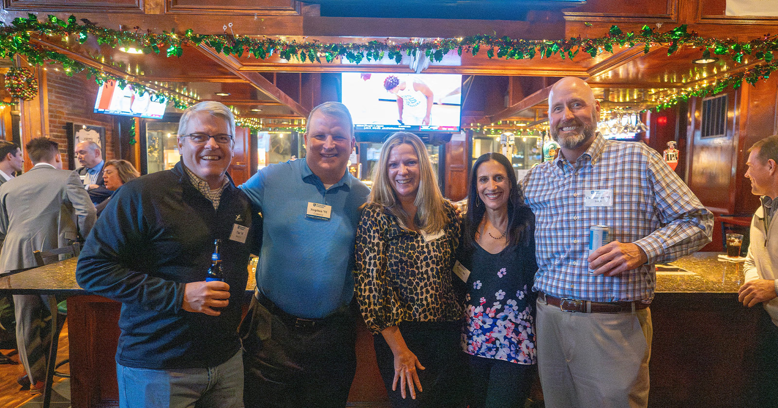 A group of Assumption University alumni attend an alumni event.