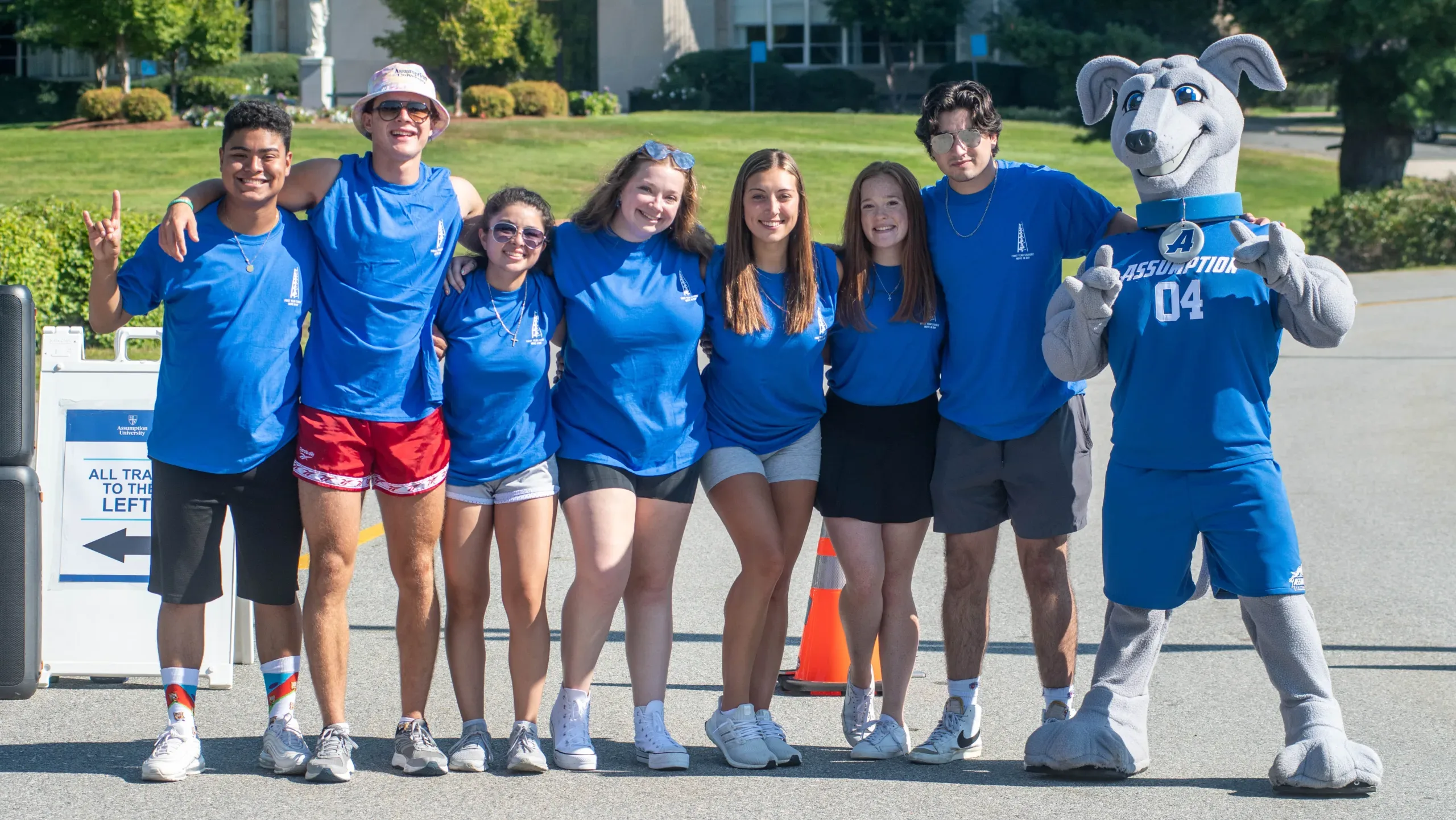 Assumption University students posing for a photo with Pierre the greyhound mascot