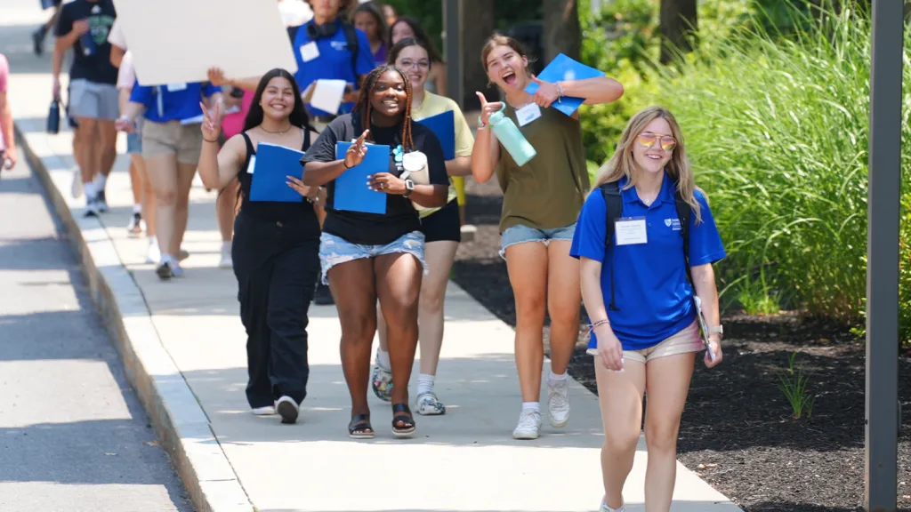 Assumption University student leading a campus tour 