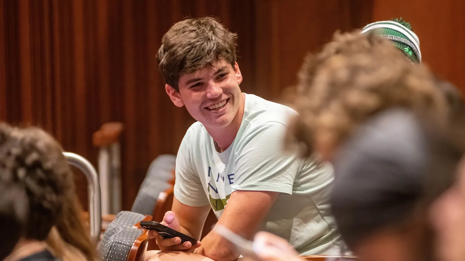 Assumption student smiling in the Curtis Performance Hall